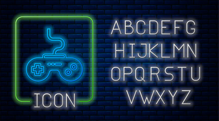 Glowing neon Gamepad icon isolated on brick wall background. Game controller. Neon light alphabet. Vector