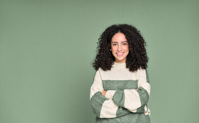 Happy young adult stylish latin woman, smiling pretty curly confident female model student wearing...