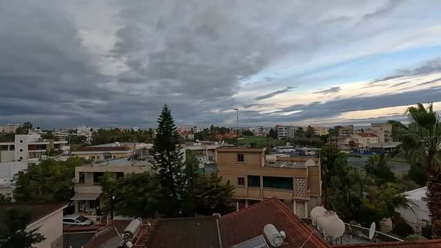 top view on houses and buildings in the city of Larnaca - Cyprus, against the background of the sunset