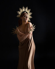 Close up fantasy portrait of beautiful woman model with red hair, goddess silk robes & ornate gold...