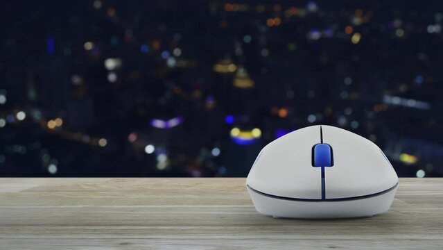 Cross shape with shield flat icon with wireless computer mouse on wooden table over blur colorful night light modern city tower and skyscraper, Business healthy and medical care insurance online