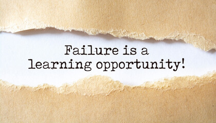 Failure is a learning opportunity. Words written under torn paper. Motivation concept text