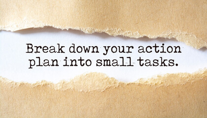 Break down your action plan into small tasks. Words written under torn paper.