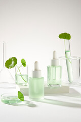 Laboratory concept with some glassware and empty label bottles with dropper to promote product...