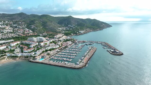 Mediterranean coast, orbital in Sitges port. Garraf coast. Drone view.