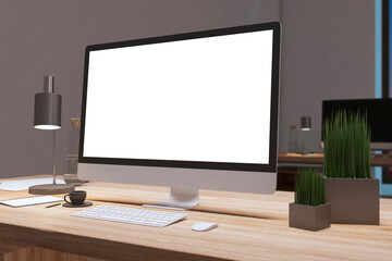 Close up of designer office desktop with empty white computer monitor, decorative items and supplies. Mock up, 3D Rendering.