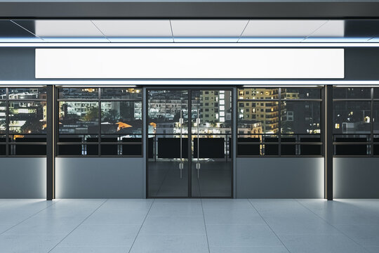 Luxury storefront with empty white wide mock up banner and night city window reflections. Mock up, 3D Rendering.