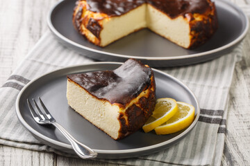 Basque cheesecake with a creamy center and a deeply caramelized crust top and bottom closeup on the...