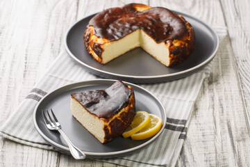 Delicious pastry Basque Burnt Cheesecake closeup on the plate Great for home party, birthday, anniversary and family gatherings. Horizontal
