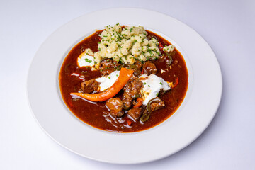 Hungarian goulash with gnocchi and ram's horns