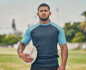 Rugby, ball and portrait of tough man on field with serious expression, confidence and pride in...