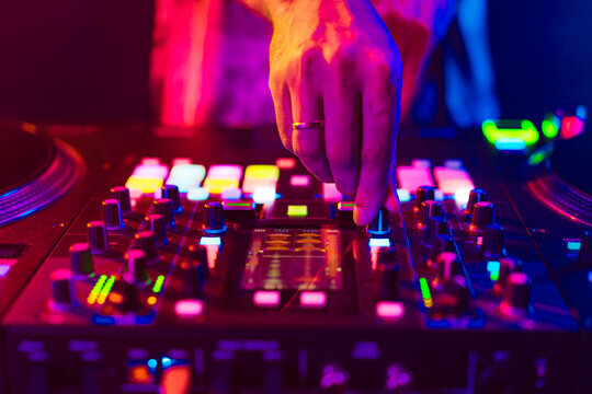 Close up of dj console mixer during concert in the club