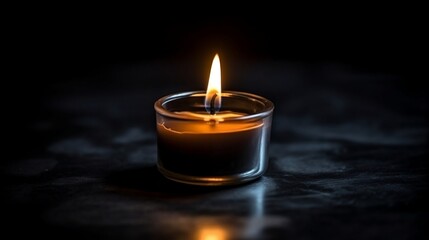 Obraz na płótnie Canvas burning candle in the dark