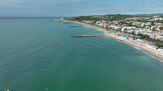 Sitges seaside. Mediterranean landscape of the beach and hotels. Travelling in along the coast.