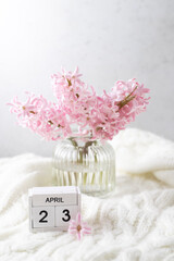 Pink hyacinth in vase and calendar date April 23. Included in the group of horizontal and vertical photos with all April dates