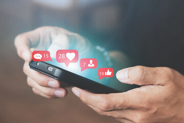 Men use smartphones to interact with social media. following news, communicating with others through emojis and online messages, notifications, opinions, or internet digital marketing creation.