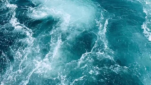 Whirlpools in blue sea water