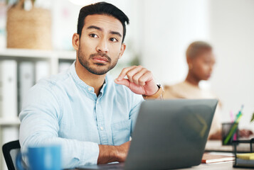 Man at desk, thinking with laptop and relax with ideas for content creation at digital marketing startup. Copywriter, thoughtful male and serious, contemplating and inspiration for copywriting job