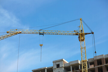 Construction crane with blue sky in the background