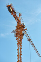 Construction crane with blue sky in the background