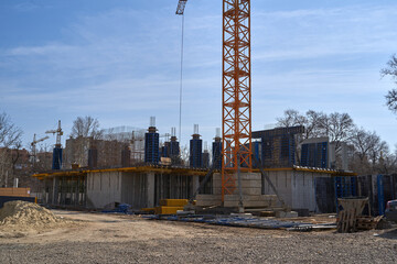 Construction site. High rise Building under construction. Construction of high-rise residential building