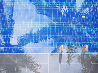 Fototapeta na wymiar Top view of swimming pool with wooden stair.
