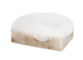Soap bar with fluffy foam on white background
