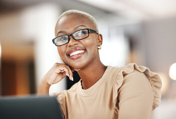 Black woman, thinking and smile, relax at desk with laptop for content creation ideas at digital...