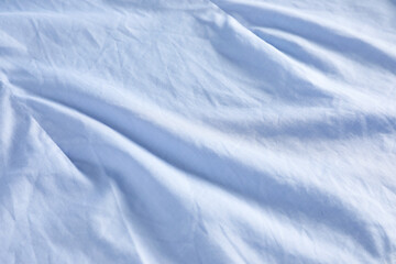Obraz premium Crumpled light blue fabric as background, closeup view