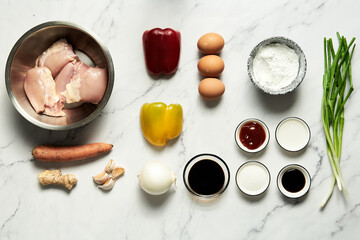 Chicken Manchurian ingredients list. Batter fried chicken with vegetables like carrot and bell peppers, sauce from soy and oyster sauce, ketchup with ginger and garlic