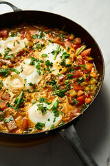 Moroccan Shakshuka. Mediterranean Goodness Shakshuka with Vibrant Colors and Bold Flavors. Breakfast dish with eggs peppers and tomatoes plus spices