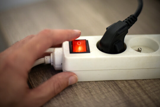 view of an electricity socket switch turned on