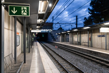 early morning at an empty subway platform station
