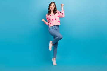 Fototapeta na wymiar Full length photo of lovely lady raise fist lottery lucky dressed stylish pink strawberry print garment isolated on blue color background