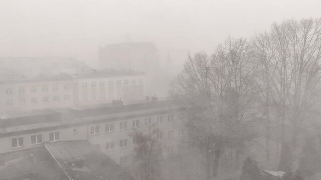 Hard snow over the city. Snowstorm in the city