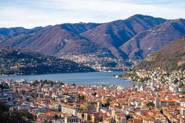 Fototapeta na wymiar The city of Como, the lake, the lakeside promenade, the buildings, photographed from above. 