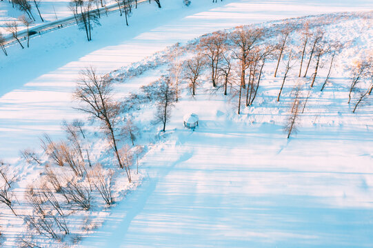 Aerial View Flight Above Frozen Creek. Amazing Aerial View On Freezing River. Scenic View Of Nature. Snowy Winter Sunny Day.