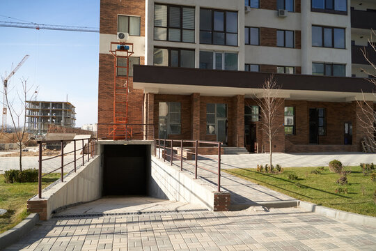 The entrance to the underground parking of the apartment building.