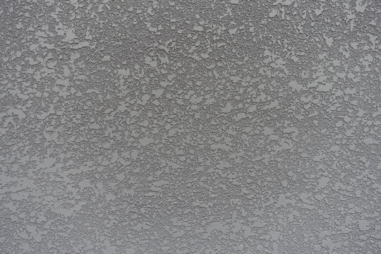 gray semi-smooth wall with stucco lace finish (front view)