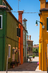 Burano, Venice Lagoon, Veneto, Italy: brightly coloured houses in a square off Fondamenta Cao di Rio a Sinistra on the Rio Terranova