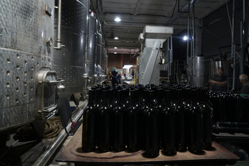 Wine cellar with alcohol distilling tanks for storing and fermenting.  Winemaking factory....