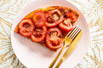 vegan homemade focaccia topped with fresh tomato