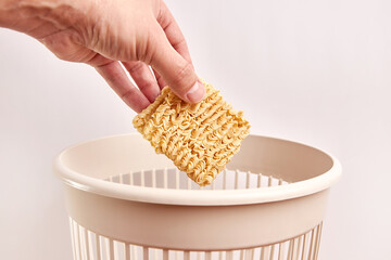 Instant vermicelli is thrown into the trash.Disposal and recycling of waste.