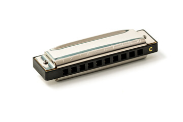 Harmonica, also French harp, blues harp, and mouth organ, isolated on white background with clipping path included. Free reed wind instrument used worldwide in blues, American folk, jazz, rock and rol