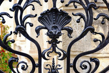 black wrought iron fence detail in Budapest, castle district. forged steel decorative elements....