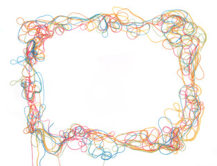 Frame of tangled colorful cotton threads isolated on white background. Abstract thread lines chaos...
