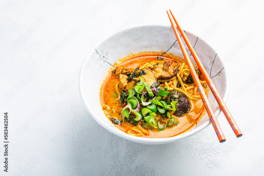 Poster Thai red curry noodle soup with shiitake,  coconut milk and onions