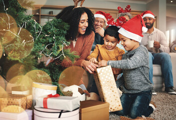 Christmas, family and boys opening a gift, celebrating a holiday and happy with a box. Smile,...