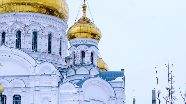 Belogorsky St. Nicholas Orthodox Missionary Monastery. Russia, Perm Krai, Belaya Gora. The temple on the hill in winter. Monastery on the background of snow. 4K