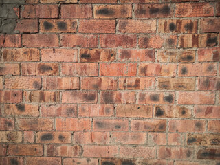 old red brick wall with stains